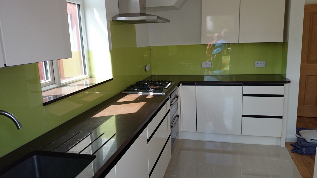Lime green glass kitchen splashback installed by Fulham glaziers
