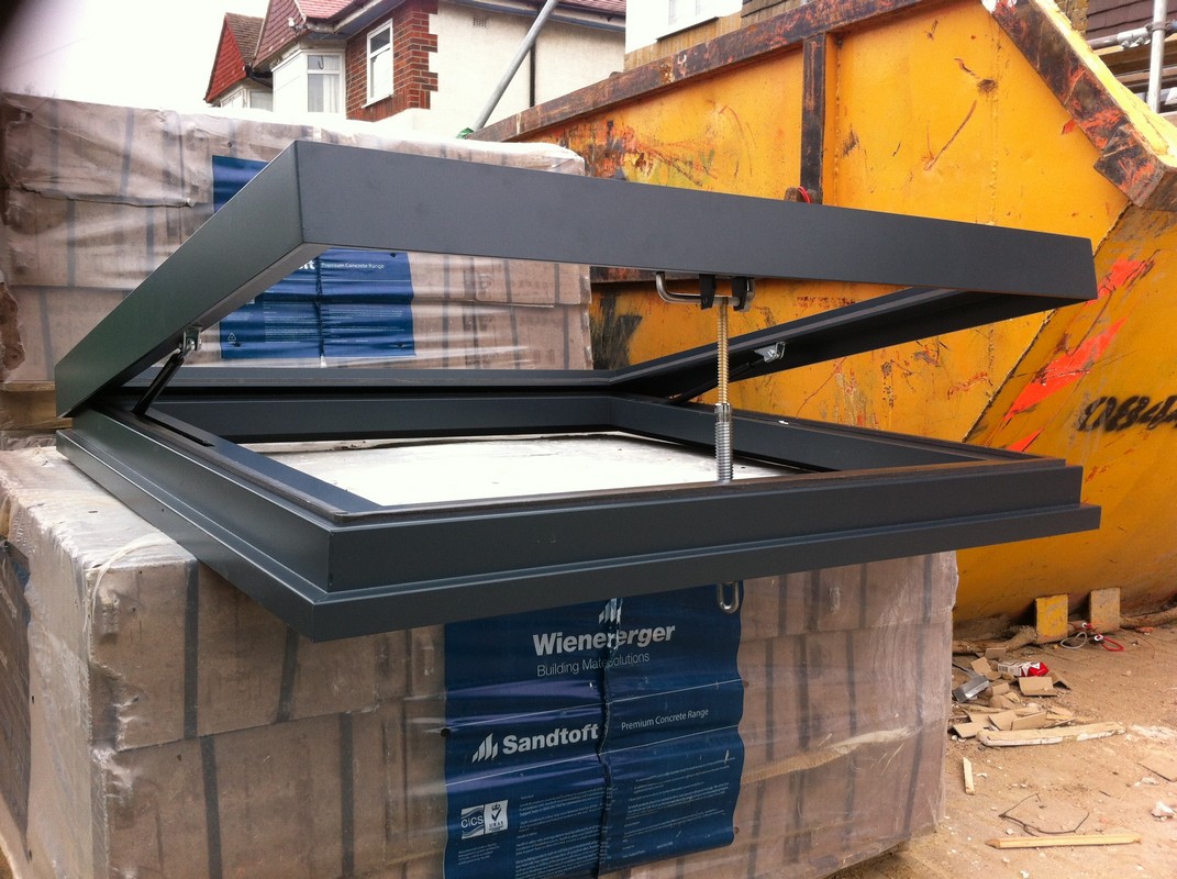 Opening flat roof skylight in anthracite grey installed in Fulham
